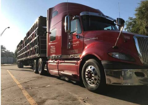 Trailer Transit Inc. truck hauling an open load