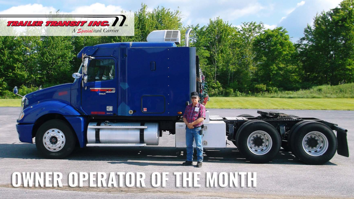 Trailer Transit, Inc. Owner Operator of the Month, Greg - August 2021 standing in front of his Blue Truck