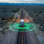 Trailer Transit, Inc. | Truck on a road with green digital graphic around it.