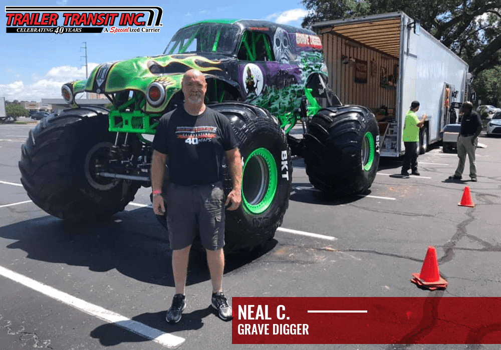 Trailer Transit Inc. | A person stands in front of a large, green monster truck labeled "Grave Digger" in a parking lot. There is also a Trailer Transit Inc. logo and text "Neal C." on the image, marking the special anniversary of their legendary partnership.
