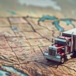 Trailer Transit, Inc. | realistic illustration of a truck driving on a topographic map of USA