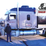 Trailer Transit Inc. | September Owner Operator of the Month, Richard, stands beside his rig.